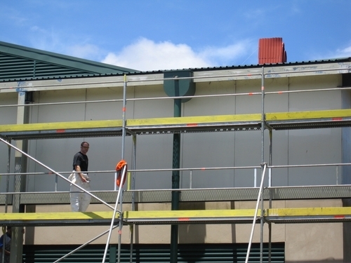 building_exterior_painting_scaffold_side_of_building