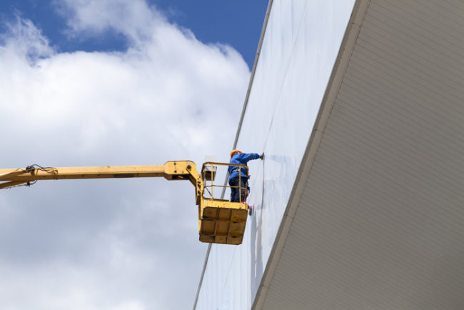 cleaning skyscrapers outside with a crane – window washing cleaning skyscrapers outside with a crane - window washing