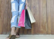 Closeup of woman holding shopping bags with copy space